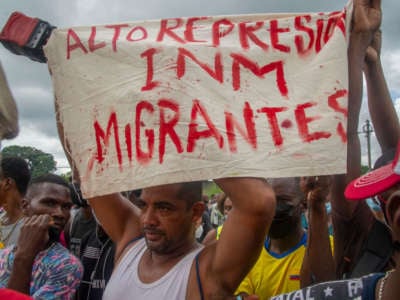 Haitian and Central American migrants protest