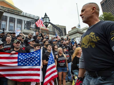 Correctional officers join demonstrators as they gather outside the Massachusetts State House in Boston to protest COVID-19 vaccination and mask mandates.