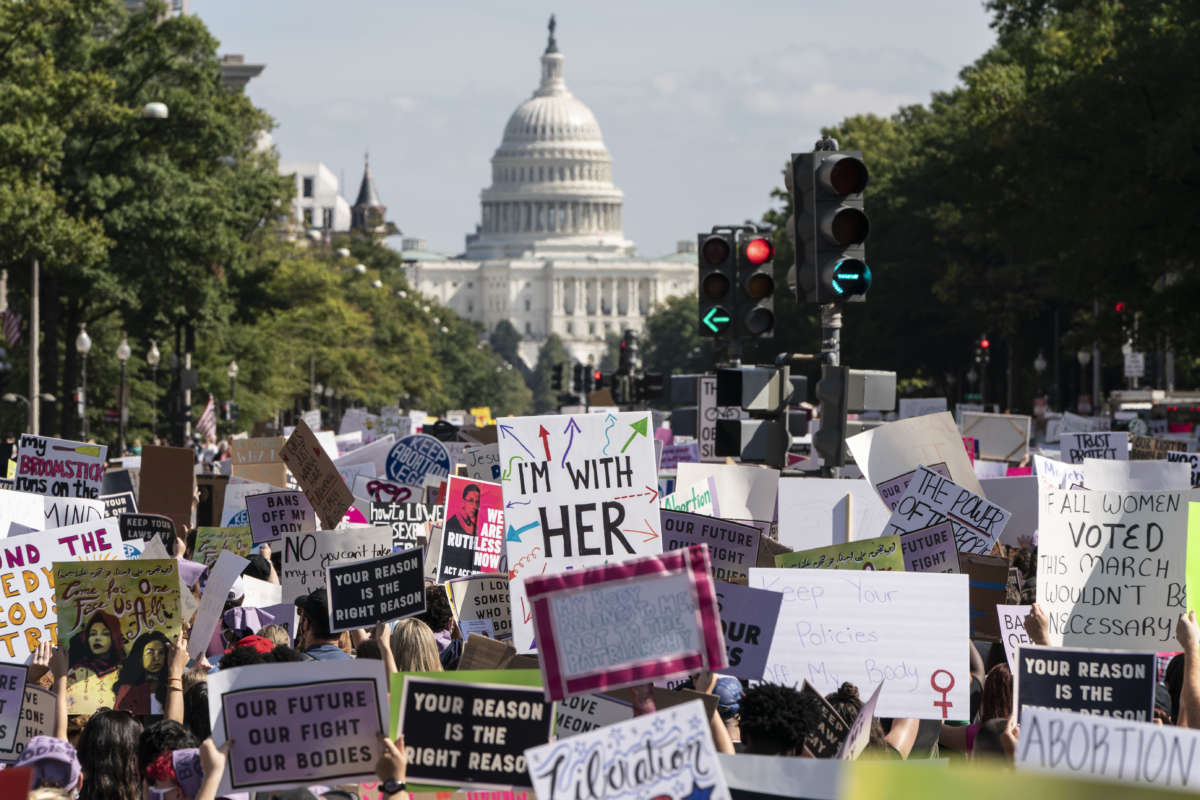 Women's rights activists march to the U.S. Capitol during the annual Women's March on October 2, 2021, in Washington, D.C.