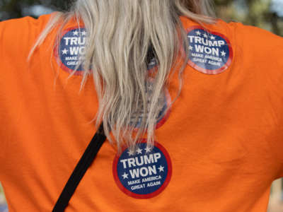A woman wears "Trump Won" stickers as people gather to show support at a watch party regarding the results of the Arizona State Senate report of an audit of the 2020 election at the Arizona State Capitol in Phoenix, Arizona, on September 24, 2021. Trump lost.