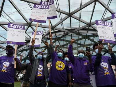 Hundreds of Denver International Airport janitors walked off the job, striking for higher pay and less taxing workload at Denver International Airport in Denver, Colorado, on October 1, 2021.