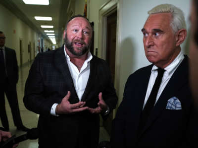 Longtime informal adviser to President Trump Roger Stone, right, and Alex Jones of Infowars speak to cameras outside a hearing at the Rayburn House Office Building on December 11, 2018, in Washington, D.C.