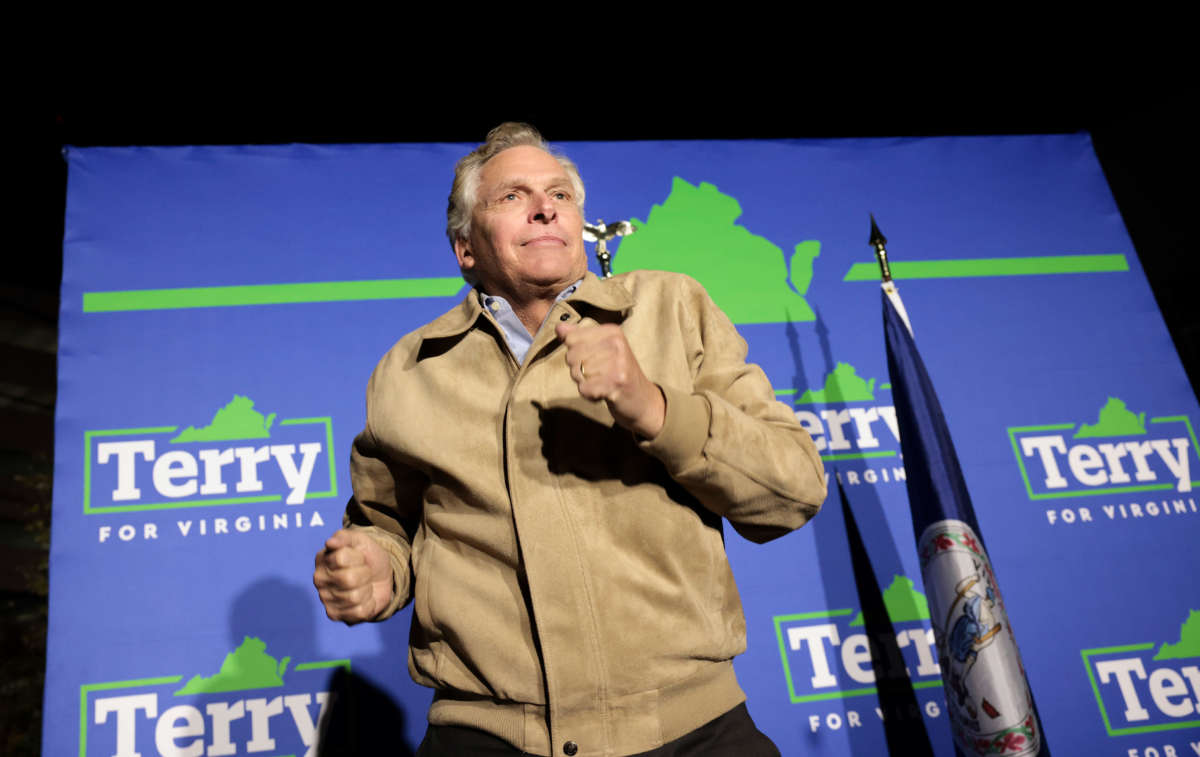 Democratic gubernatorial candidate, former Virginia Gov. Terry McAuliffe, takes the stage during a campaign event at Caboose Commons on November 1, 2021 in Fairfax, Virginia.