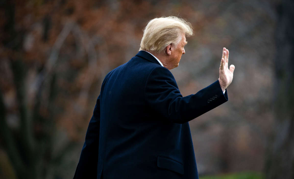 President Donald Trump waves as he departs on the South Lawn of the White House, on December 12, 2020, in Washington, D.C.