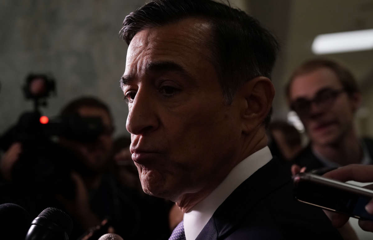 Rep. Darrell Issa speaks to members of the media at a hallway of the Rayburn House Office Building on Capitol Hill on December 7, 2018, in Washington, D.C.