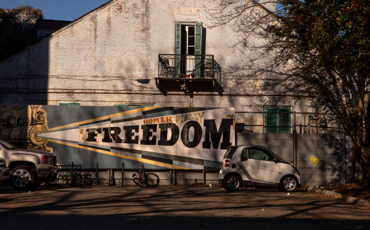 Sign with a train with Homer Plessy Freedom printed on it on February 26, 2020, at Homer Plessy Community School, New Orleans, Louisiana.