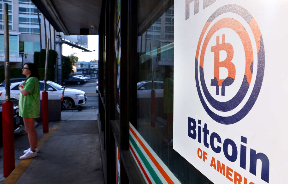 A sign advertising a Bitcoin ATM is posted at a 7-Eleven store on November 10, 2021, in Los Angeles, California.