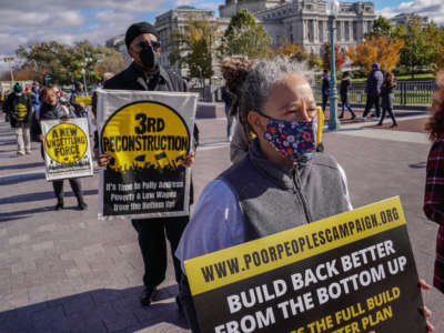 People demonstrate at the U.S. Capitol during the MoveOn and Poor People's Campaign's Build Back Better Action on November 15, 2021, in Washington, D.C.