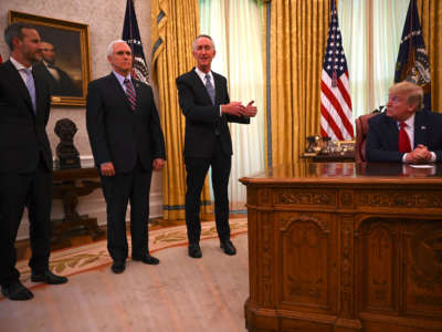 President Donald Trump, right, Vice President Mike Pence and U.S. International Development Finance Corporation CEO Adam Boehler, left, listen to Daniel O'Day, CEO of Gillead Sciences Inc., as he speaks in the Oval Office of the White House on May 1, 2020, in Washington, D.C.