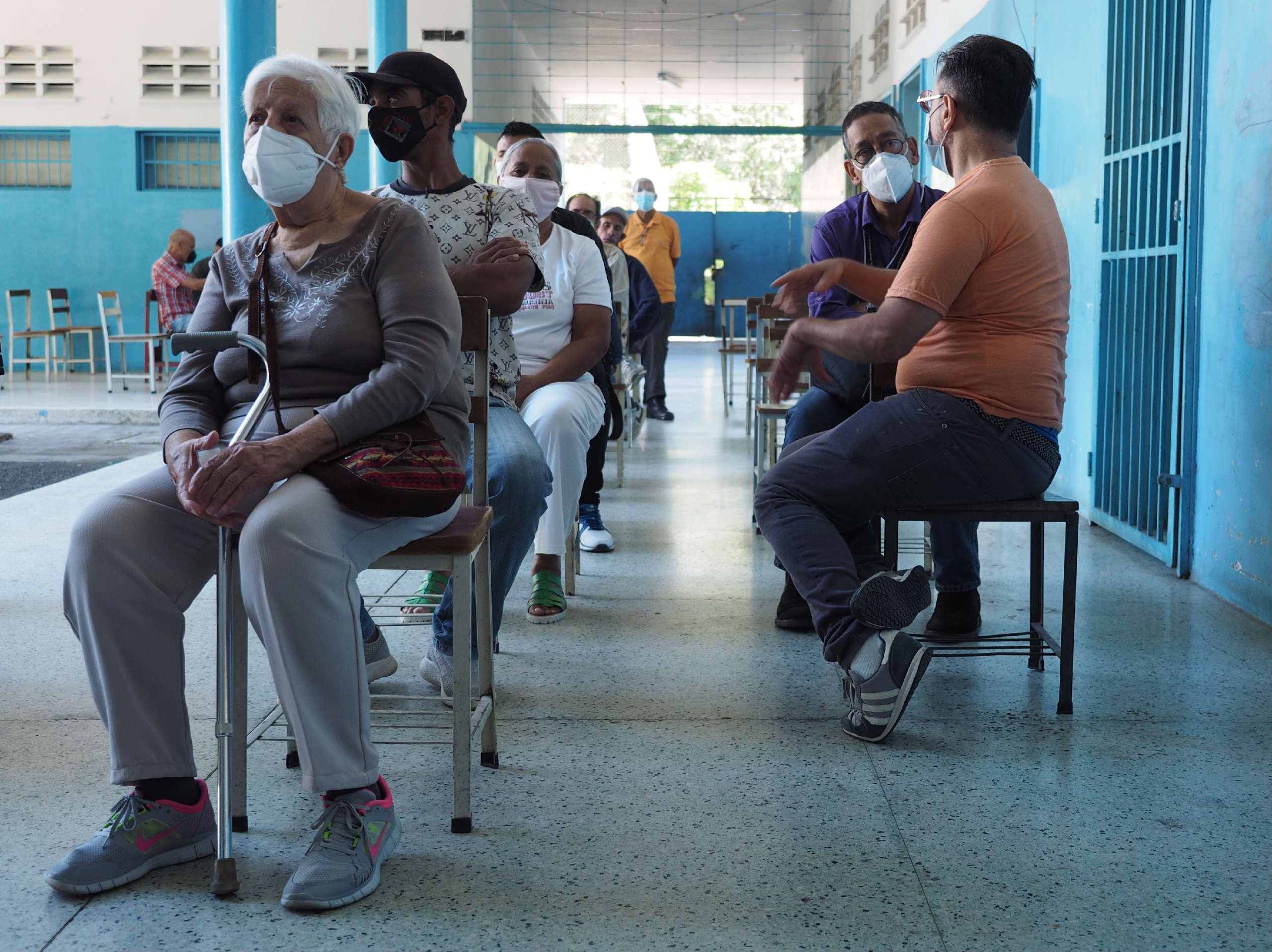 Voters await their turn to vote, abiding by health protocols, inside the Liceo Pedro Emilio Coll in the Coche Parish in Caracas, Venezuela during elections on November 21, 2021.