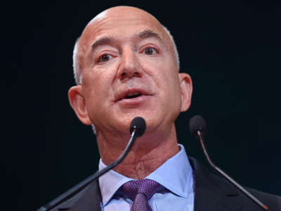 Jeff Bezos speaks into a microphone