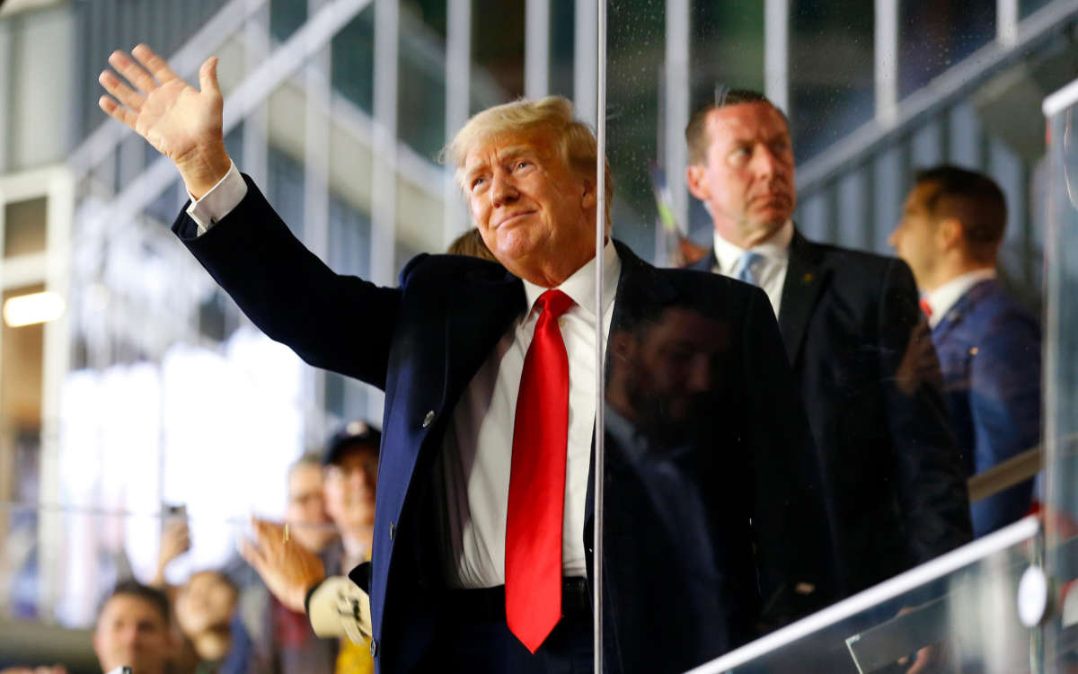 Former President Donald Trump waves prior to Game Four of the World Series at Truist Park on October 30, 2021, in Atlanta, Georgia.