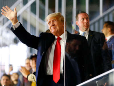 Former President Donald Trump waves prior to Game Four of the World Series at Truist Park on October 30, 2021, in Atlanta, Georgia.