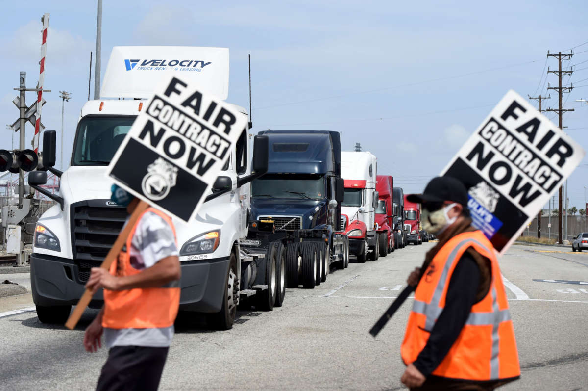 Longshore workers walk off the job in solidarity with teamsters to picket and disrupt traffic to one of the Port of Los Angeles's seven terminals in San Pedro on April 14, 2021.