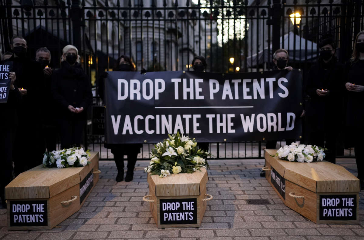 Protesters organized by Campaign group Global Justice Now outside Downing Street in Westminster, London, demonstrate against the UK's blocking of a waiver for the patent of the COVID-19 vaccine on October 12, 2021.