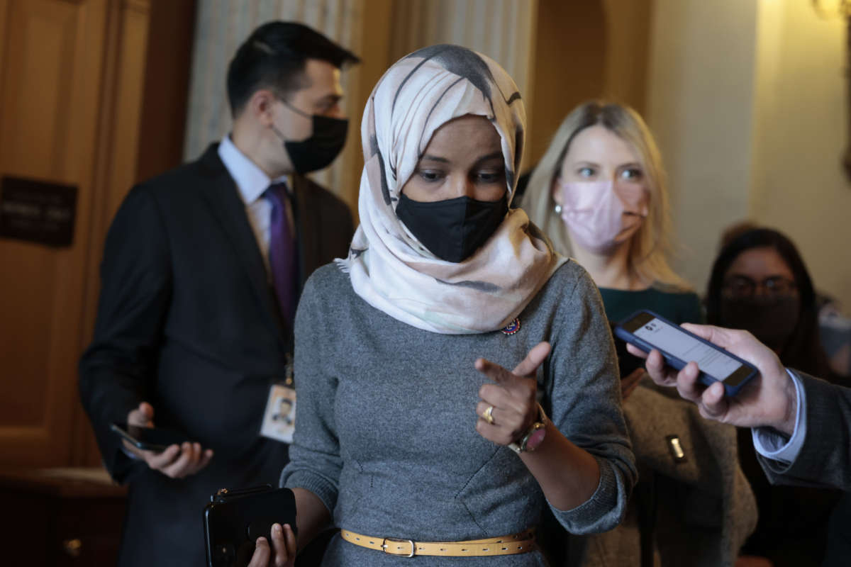Rep. Ilhan Omar speaks with a reporter as she leaves the U.S. Capitol Building on November 16, 2021, in Washington, D.C.