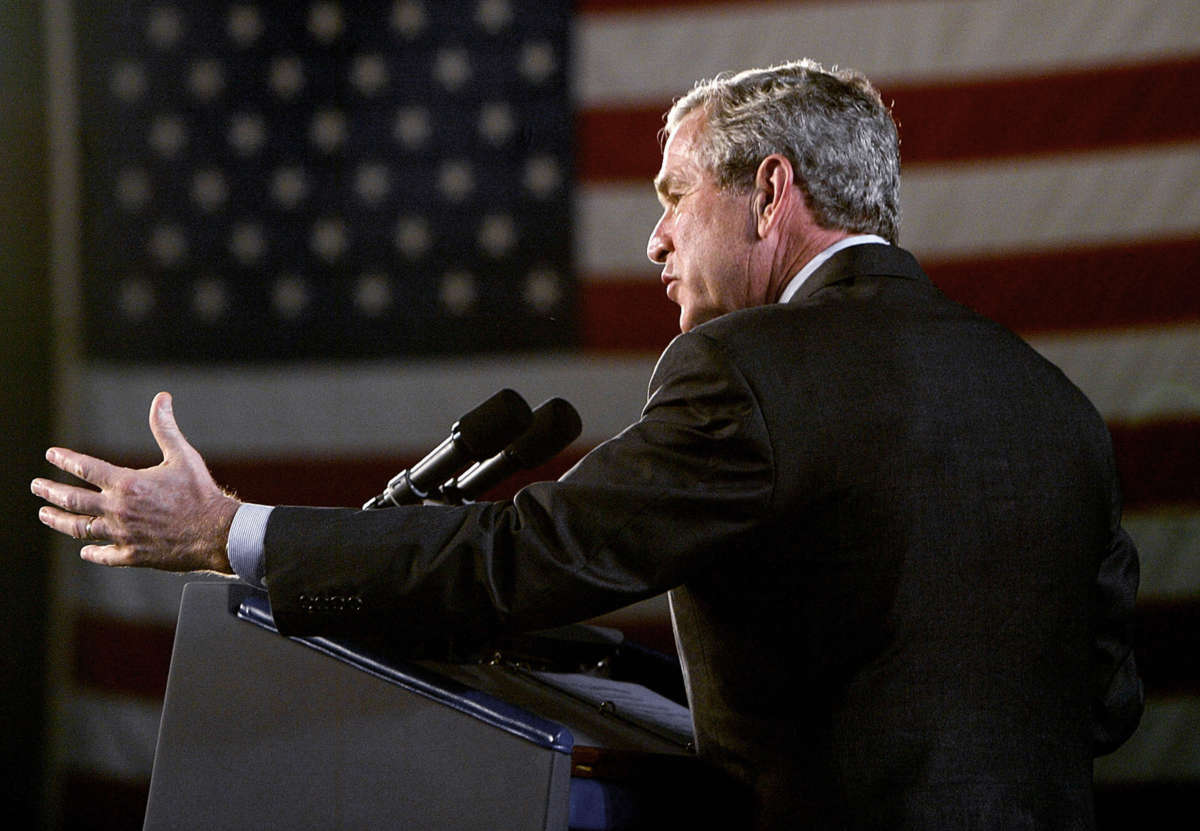 Former President George W. Bush gestures as he speaks on Homeland Security and the Patriot Act at the Port of Baltimore, in Maryland, on July 20, 2005.