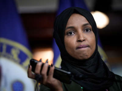 Rep. Ilhan Omar plays a voicemail containing a death threat during a news conference about Islamophobia on Capitol Hill on November 30, 2021, in Washington, D.C.