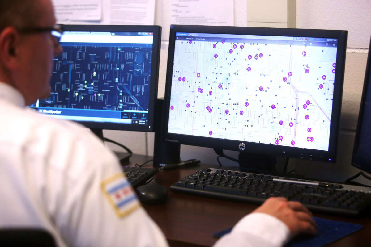 In this photo from 2017, police monitor ShotSpotter and other crime detection programs at the Chicago Police Department 7th District's Strategic Decision Support Center.