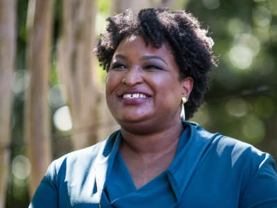 Former Representative and voting rights activist Stacey Abrams is introduced before speaking at a Souls to the Polls rally on October 17, 2021, in Norfolk, Virginia.