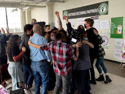 Starbucks employees celebrate after unionization votes are counted, on December 9, 2021 in Buffalo, New York.