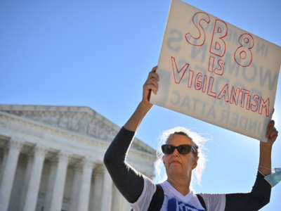 A pro-choice demonstrator is seen outside of the Supreme Court in Washington, D.C., on November 1, 2021.