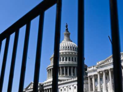 The United States Capitol, as seen through bars