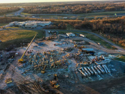 An aerial view of debris and structural damage is seen at the Mayfield Consumer Products candle factory as search and rescue operations underway after tornadoes hit Mayfield, Kentucky, on December 13, 2021.