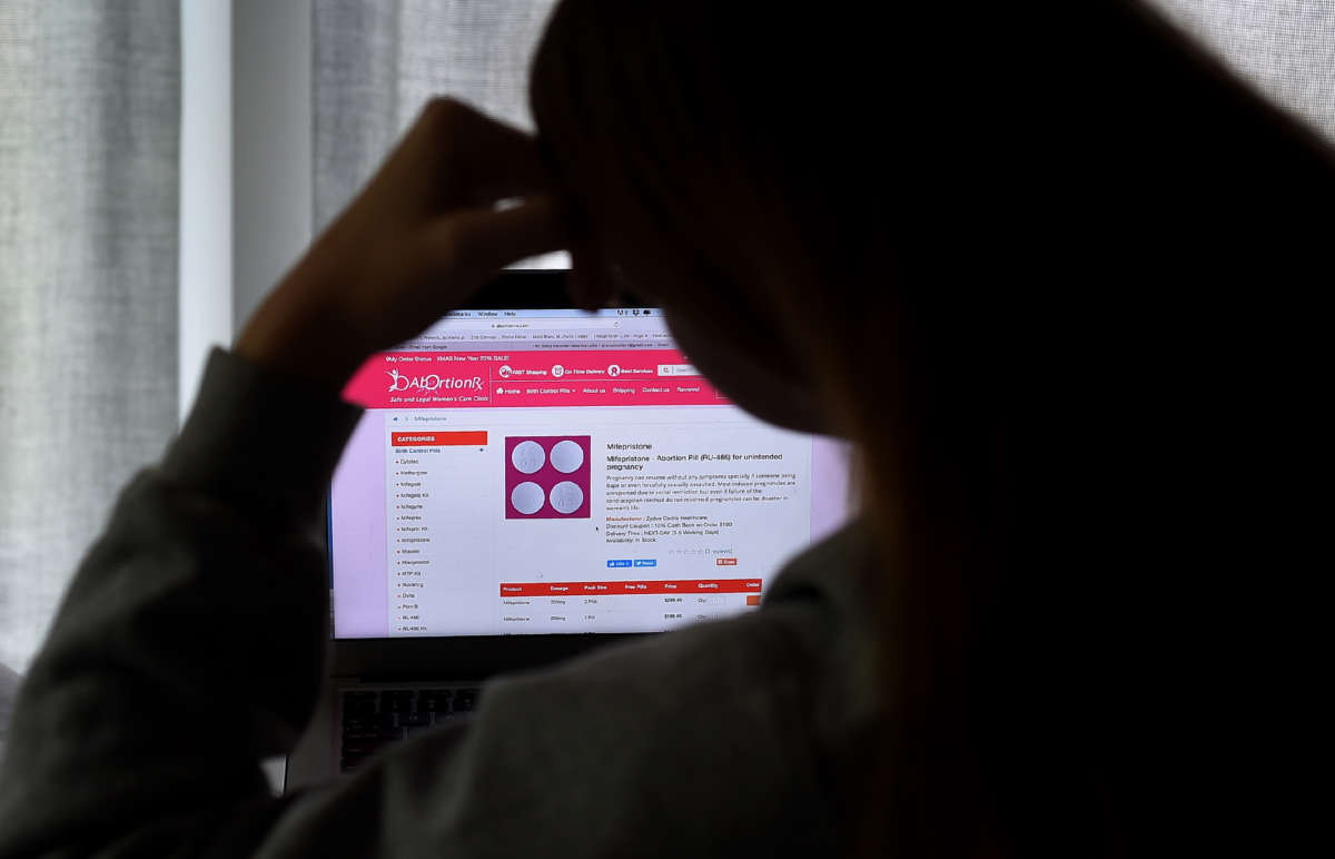 A person looks at an abortion pill (RU-486) for unintended pregnancy from Mifepristone displayed on a computer on May 8, 2020, in Arlington, Virginia.