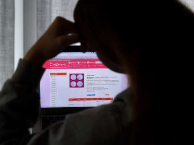 A person looks at an abortion pill (RU-486) for unintended pregnancy from Mifepristone displayed on a computer on May 8, 2020, in Arlington, Virginia.
