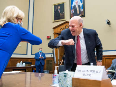 U.S. Postal Service Postmaster General Louis DeJoy greets Chairwoman Carolyn Maloney at the Rayburn House Office Building on August 24, 2020, in Washington, D.C.