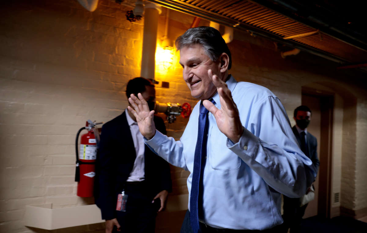 Sen. Joe Manchin walks out of a meeting with fellow Democratic senators for a break in the basement of the U.S. Capitol Building on December 15, 2021, in Washington, D.C.