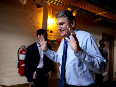 Sen. Joe Manchin walks out of a meeting with fellow Democratic senators for a break in the basement of the U.S. Capitol Building on December 15, 2021, in Washington, D.C.