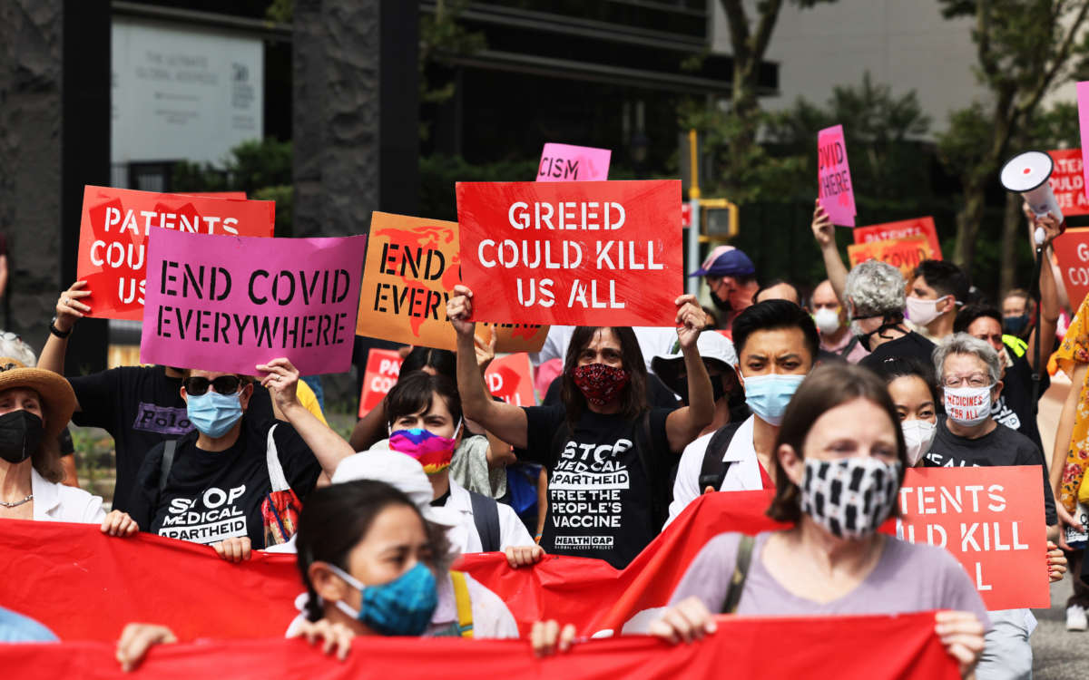 People gather for a protest demanding Pfizer and wealthy nations make the COVID-19 vaccine and treatments more accessible at One Dag Hammarskjöld Plaza on July 14, 2021, in New York City.