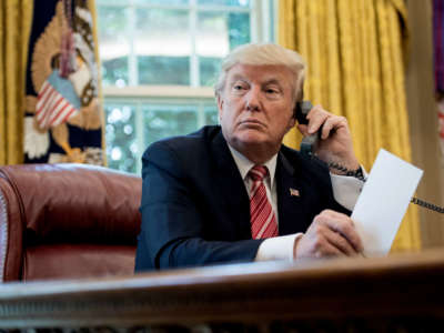 President Donald Trump waits to speak on the phone in the Oval Office at the White House in Washington, D.C, on June 27, 2017.