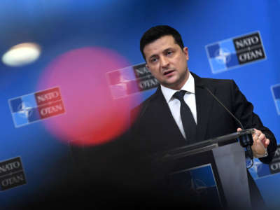 Ukrainian President Volodymyr Zelensky talks during a press conference with the NATO secretary general after their bilateral meeting at the European Union headquarters in Brussels on December 16, 2021.