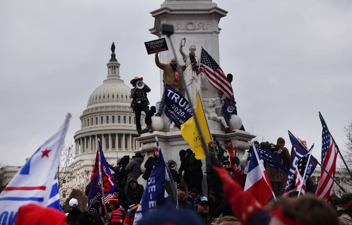 Trump supporters gather outside the U.S. Capitol building following a "Stop the Steal" rally on January 6, 2021, in Washington, D.C.