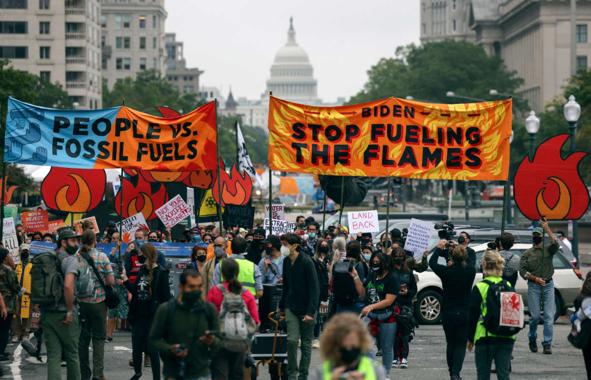 Climate protesters march to the White House on October 12, 2021, in Washington, D.C.