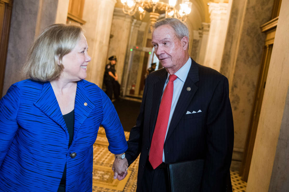 Former Senators John Breaux and Mary Landrieu are seen in the Capitol on June 11, 2019.