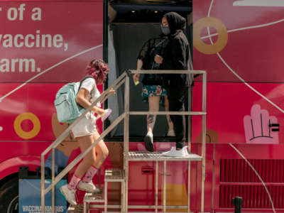 A teenager enters a pop-up COVID-19 vaccine site on June 5, 2021, in the Jackson Heights neighborhood in the Queens borough in New York City.