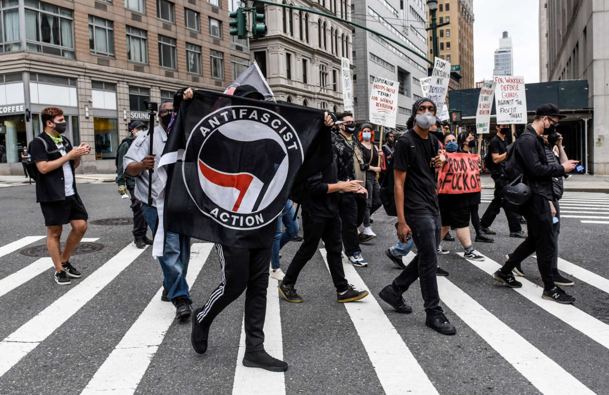 Anti-fascist demonstrators hold a counter protest against right-wing demonstrators participating in a political rally on July 25, 2021, in New York City.