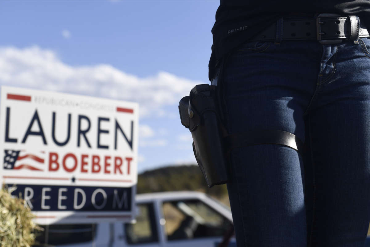 Lauren Boebert wears a firearm while addressing supporters during a campaign rally in Colona, Colorado, on October 10, 2020.