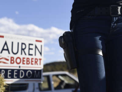 Lauren Boebert wears a firearm while addressing supporters during a campaign rally in Colona, Colorado, on October 10, 2020.