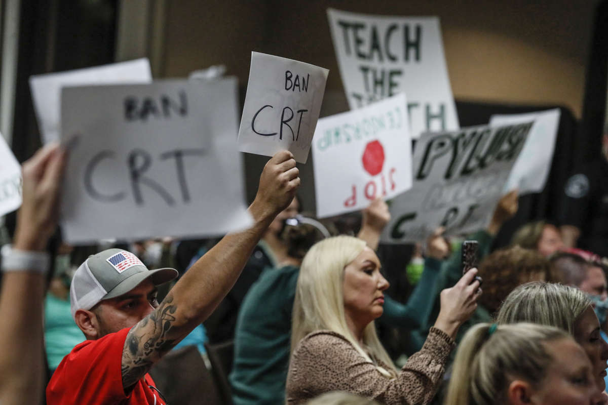 Proponents and opponents to teaching Critical Race Theory demonstrate as the Placentia Yorba Linda School Board in Yorba Linda, California, discusses a proposed resolution to ban it from being taught in schools, on November 16, 2021.