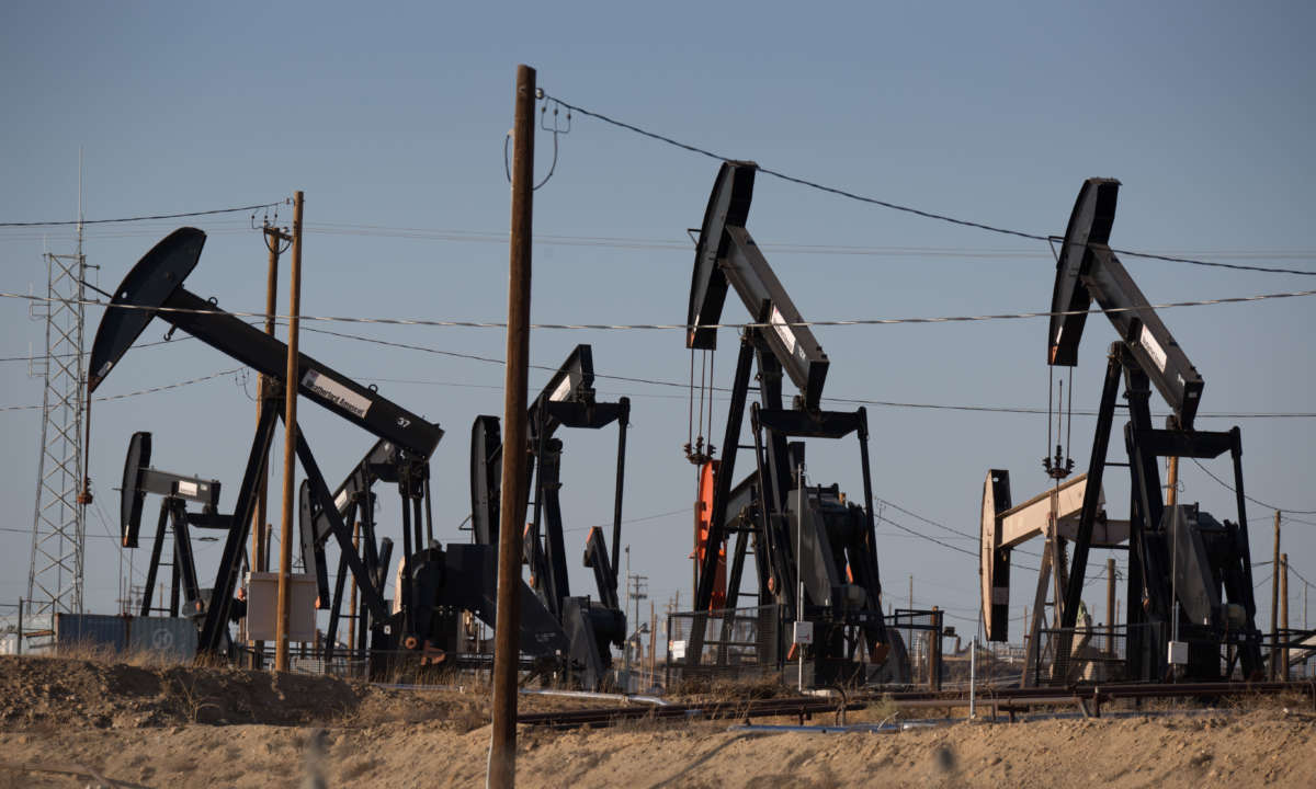 Oil pumpjacks line the horizon in Chevron's Kern River Oil Field, one of the largest in the United States, located just north and east of Bakersfield, on July 7, 2021, in Oildale, California.