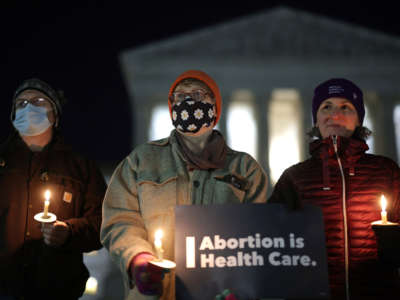 Activists participate in a candlelight vigil on abortion rights in front of the U.S. Supreme Court on December 13, 2021, in Washington, D.C.