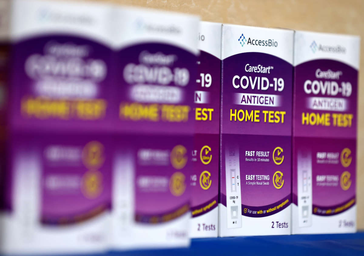 COVID-19 rapid at-home test kits rest on a table at a free distribution event for those who received vaccination shots or booster shots, at Union Station, on January 7, 2022, in Los Angeles, California.