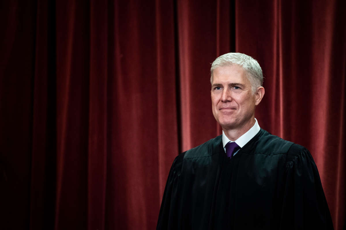 Associate Justice Neil Gorsuch poses with other Justices of the U.S. Supreme Court during their official group photo at the Supreme Court on November 30, 2018, in Washington, D.C.