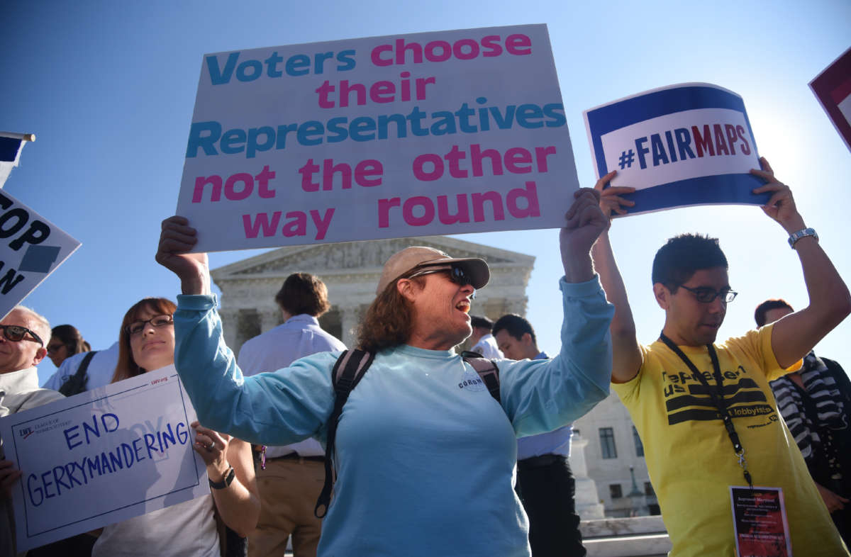 Demonstrators gather outside of the U.S. Supreme Court on October 3, 2017, in Washington, D.C.