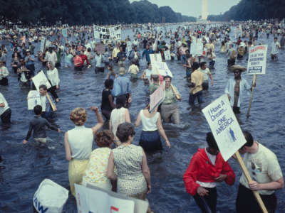Protestors wade in the Lincoln Memorial Reflecting Pool in Washington, D.C., during the Poor People's March on Washington on June 19, 1968.